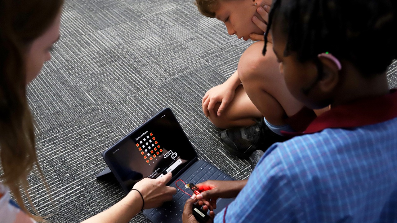 Students working together using digital technology in the classroom, highlighting collaboration, problem solving and technology‑enhanced learning at St Bernardine’s School