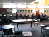 Students operating computers in the library